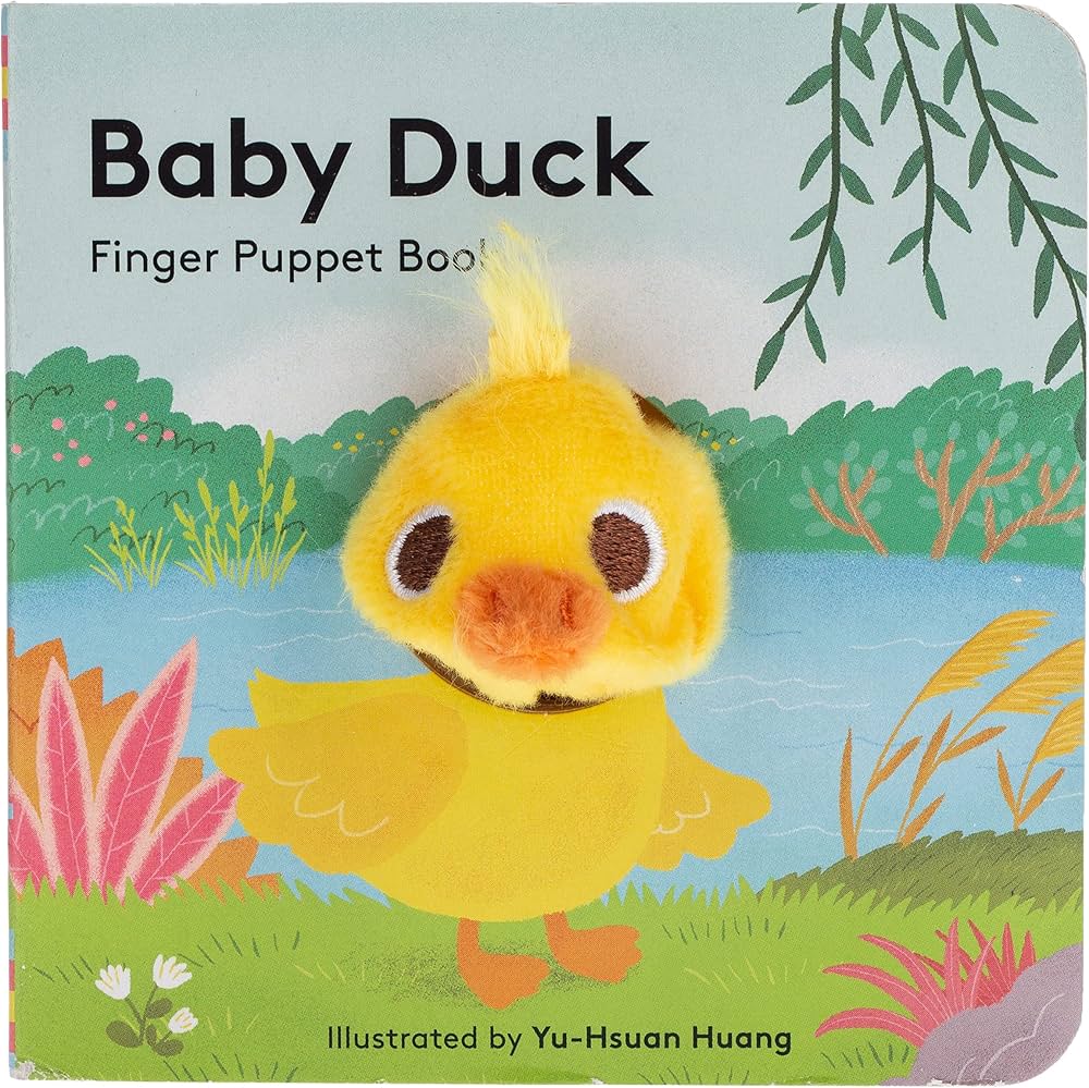 Front cover of the children's book 'Baby Duck Finger Puppet Book' featuring a plush yellow duck with a raised beak and wavy crest on a colorful illustrated background of grass, water, plants, and willow branches.