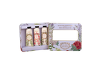 A hand care collection gift set in a floral-patterned metal tin, shown open with three squeeze tubes inside and a mirror on the outer panel.