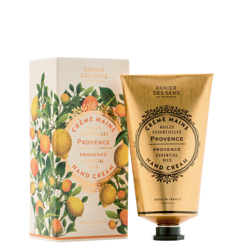 Hand cream packaging with a decorative box featuring orange and lemon illustrations on a white background.