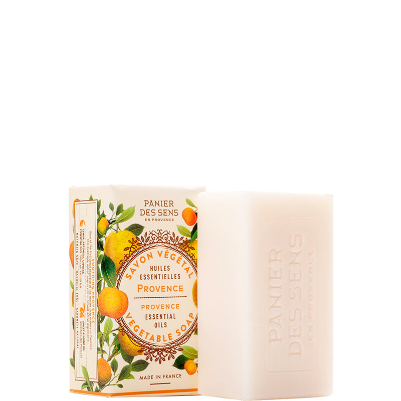 A bar of Panier Des Sens Provence vegetable oil soap next to its illustrated packaging box, featuring orange and yellow citrus graphics on a white background.