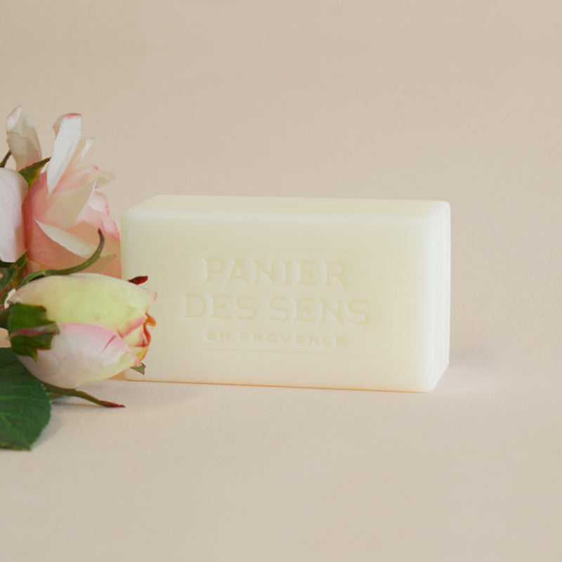 Bar of soap with floral design on a beige background