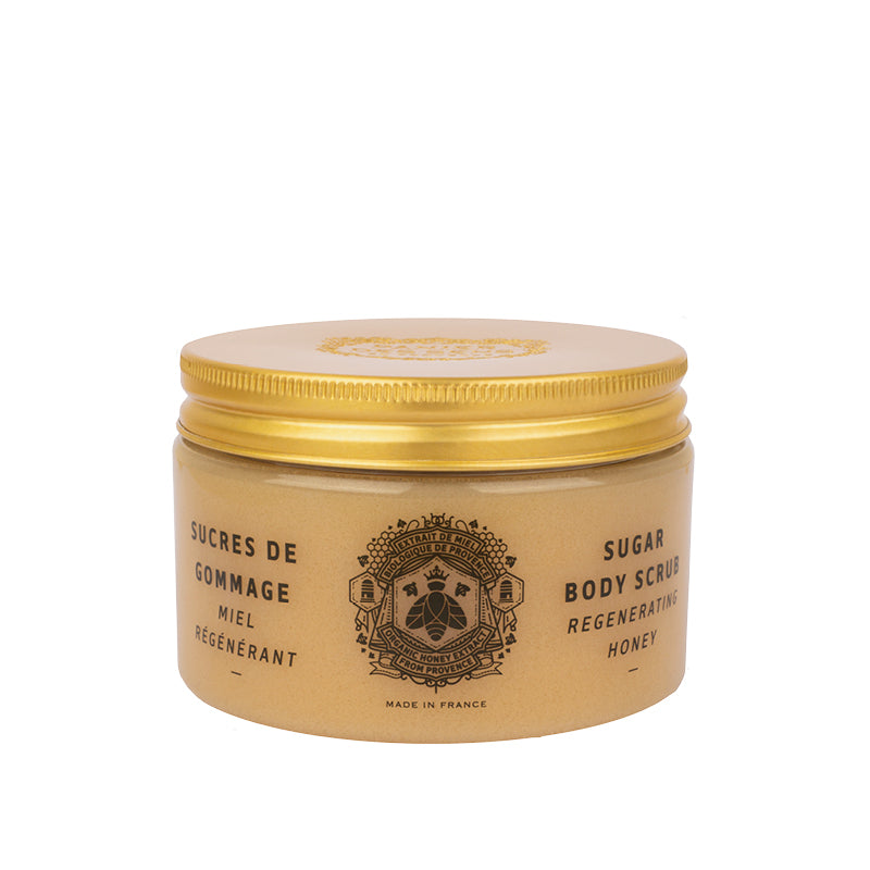 Jar of sugar body scrub with gold lid on a white background