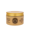 Jar of sugar body scrub with gold lid on a white background