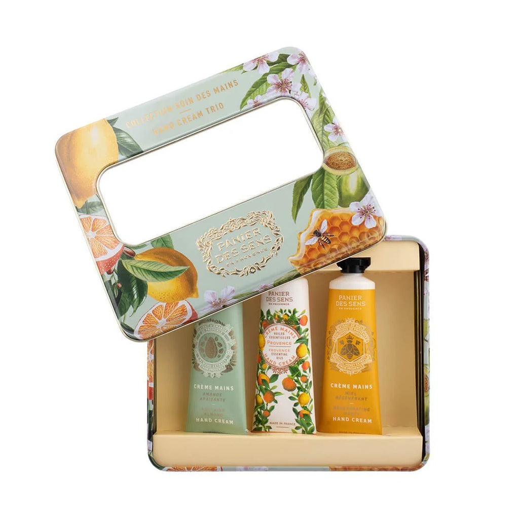 Set of skincare products in a decorative tin with citrus-themed design
