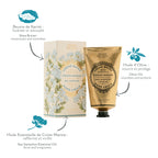 A hand cream and hand body cream set from Fancer des Sens, featuring a gold squeeze tube and its matching illustrated box. The image includes French text callouts pointing to the products and ingredients: shea butter, sea samphire essential oil, and olive oil.