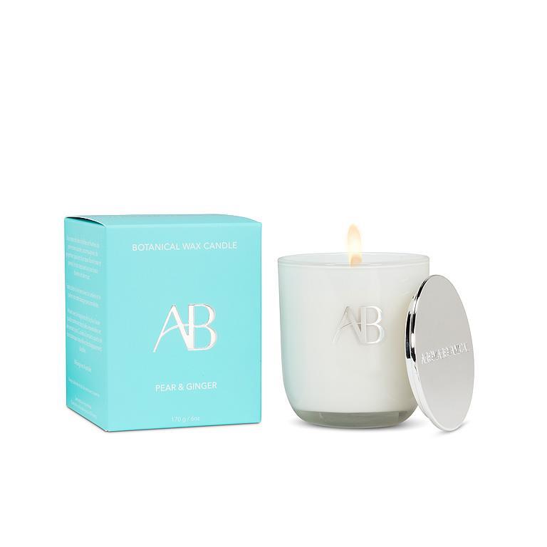 White candle with lid and teal box featuring 'AB' logo on a white background