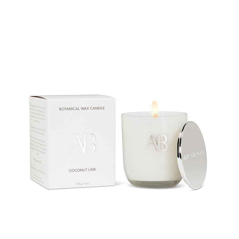 White candle with lid and packaging on a white background
