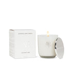 White candle with lid and packaging on a white background