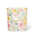 Glass candle with floral pattern on a white background