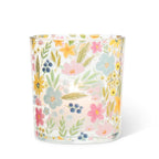 Glass candle with floral pattern on a white background