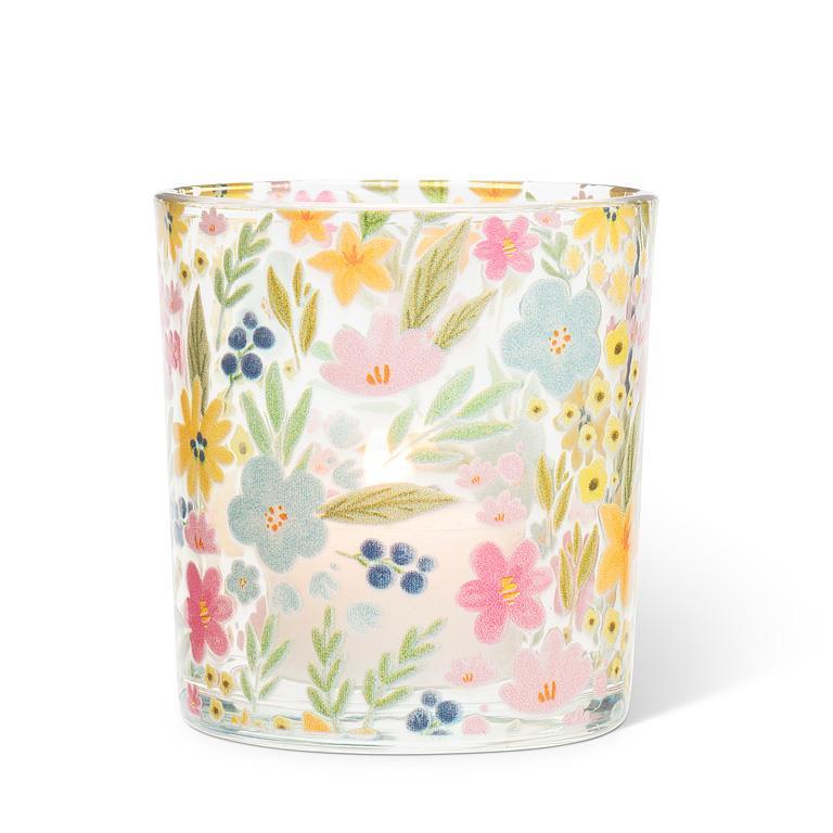 Glass candle with floral pattern on a white background