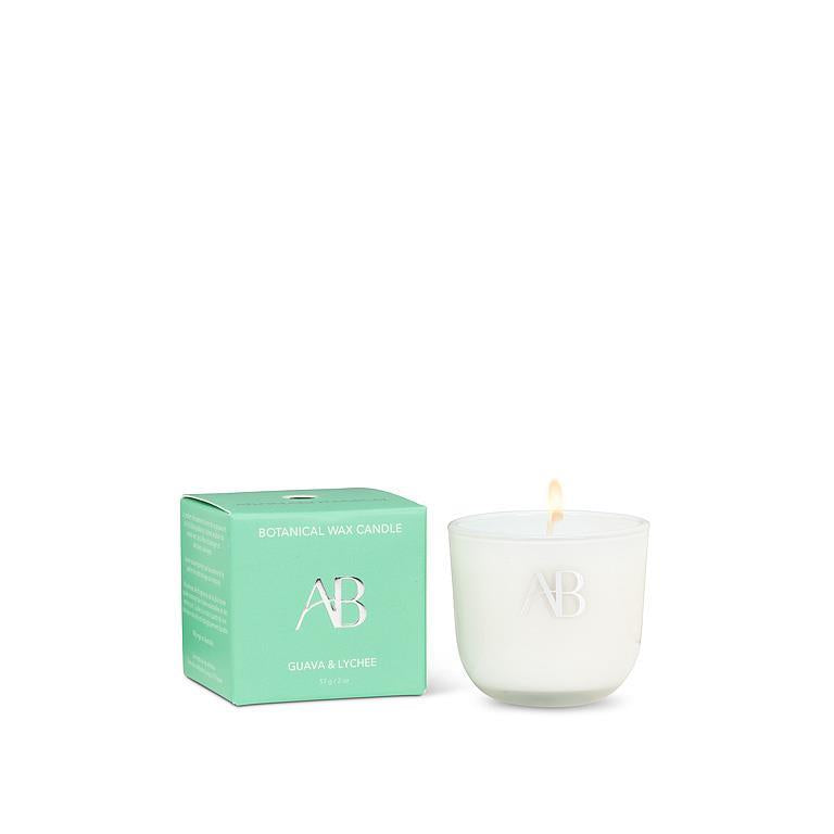 White candle with 'AB' logo next to a green box on a white background