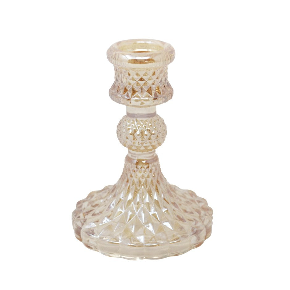 Decorative candle holder with intricate design on a white background