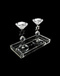 Crystal candle holder with star designs on a black background