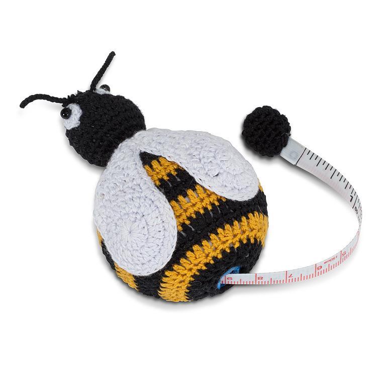 Crocheted bee-shaped tape measure on a white background