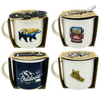 Four mugs with outdoor-themed designs and packaging on a white background