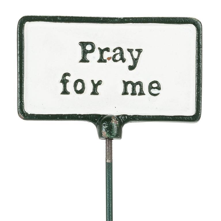 Metal sign with 'Pray for me' text on a white background