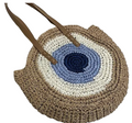 Round woven bag with a blue and white center and brown handle on a white background