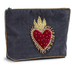 Velvet pouch with a red heart and gold accents on a white background