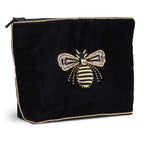 Black pouch with a bee design on a white background