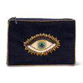 Black clutch with an eye-shaped embellishment on a white background