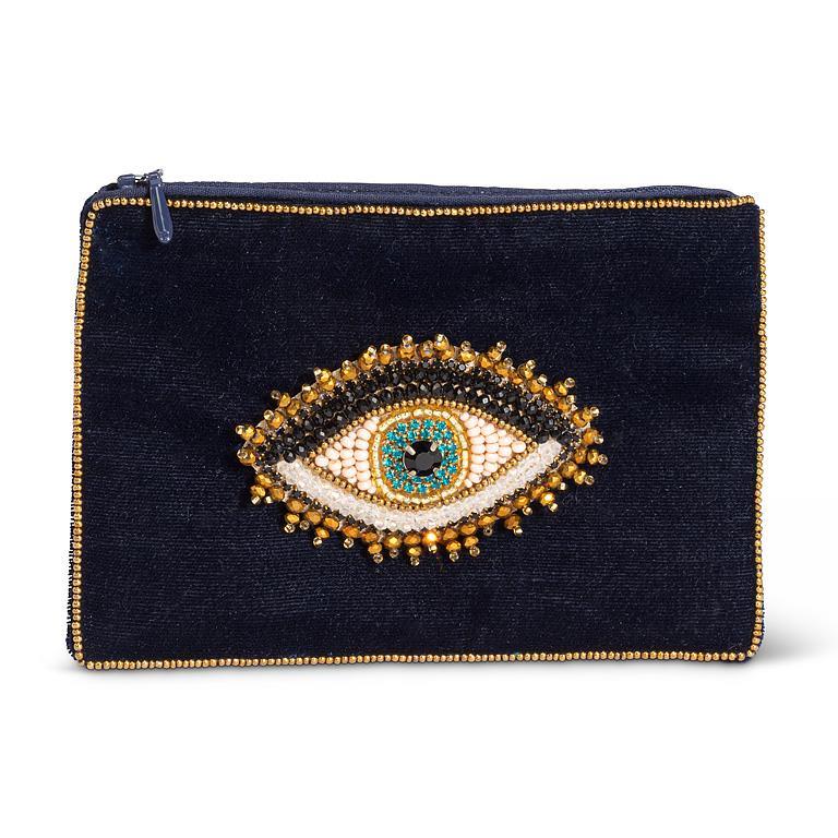 Black clutch with an eye-shaped embellishment on a white background