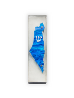 Blue decorative mezuzah with a white emblem in a clear box on a white background