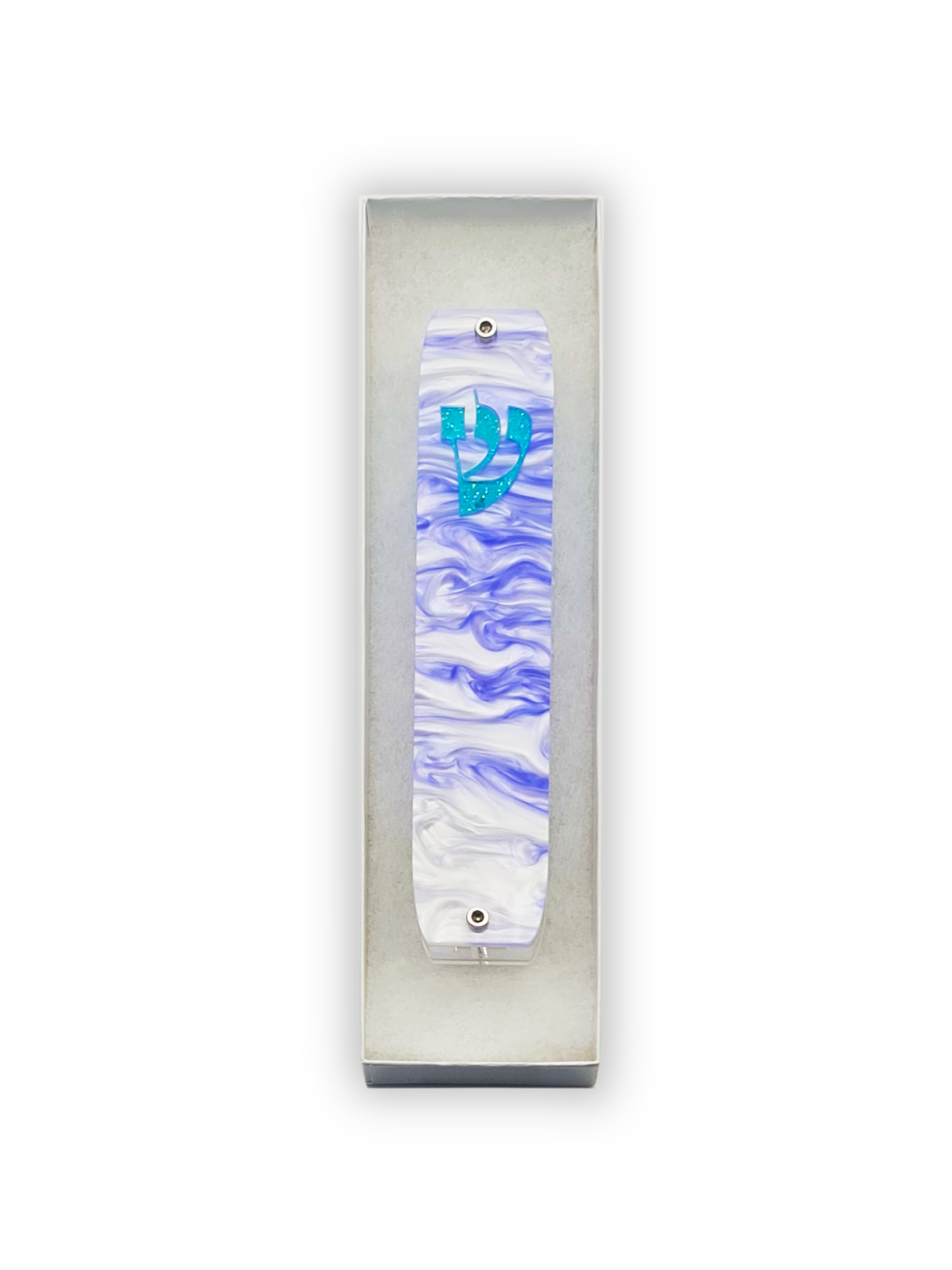 Mezuzah case with blue and white design on a white background