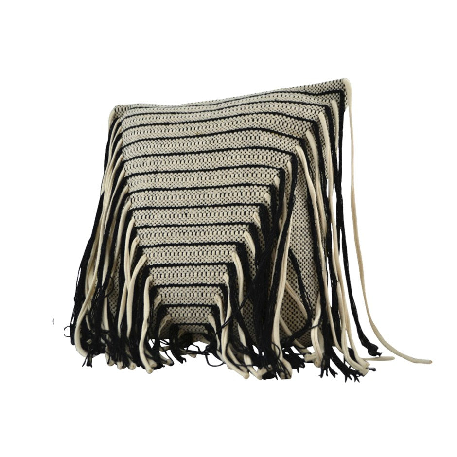 Black and white striped pillow with fringes on a white background