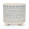 Decorative ceramic planter with blue and white pattern on a white background