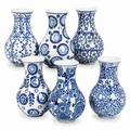 Six blue and white patterned ceramic vases arranged in two rows on a plain white background.