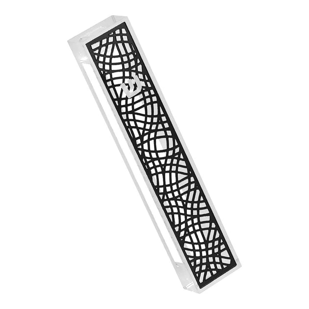 Decorative mezuzah with intricate cut-out black pattern on a white background