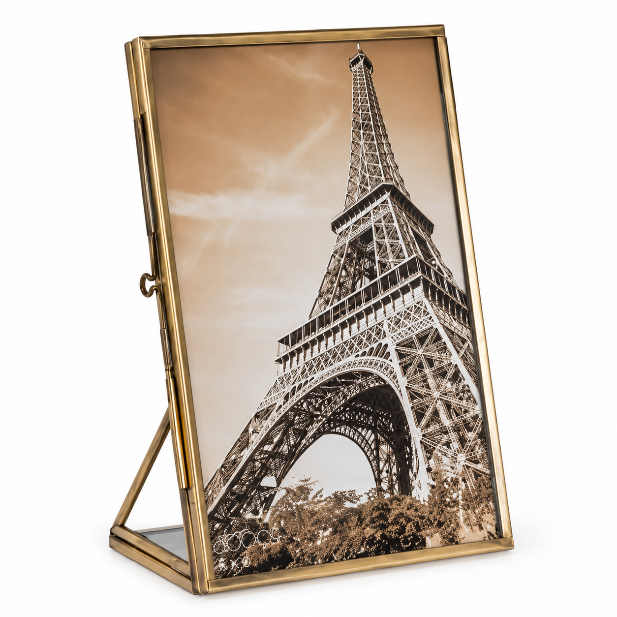 A gold-framed picture frame with an easel stand, displaying a sepia-toned photograph of the Eiffel Tower, shown on a plain white background.