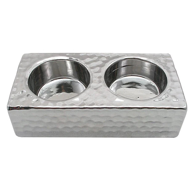 Metallic double candle holder on a white background