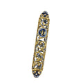 Decorative gold and blue object on a white background