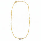A delicate gold chain necklace with a small rectangular bezel-set clear gemstone pendant, displayed on a clean white background.