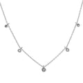 A silver-toned delicate necklace featuring a fine chain with five small circular bezel-set clear stones, including one larger central pendant, displayed on a solid white background.