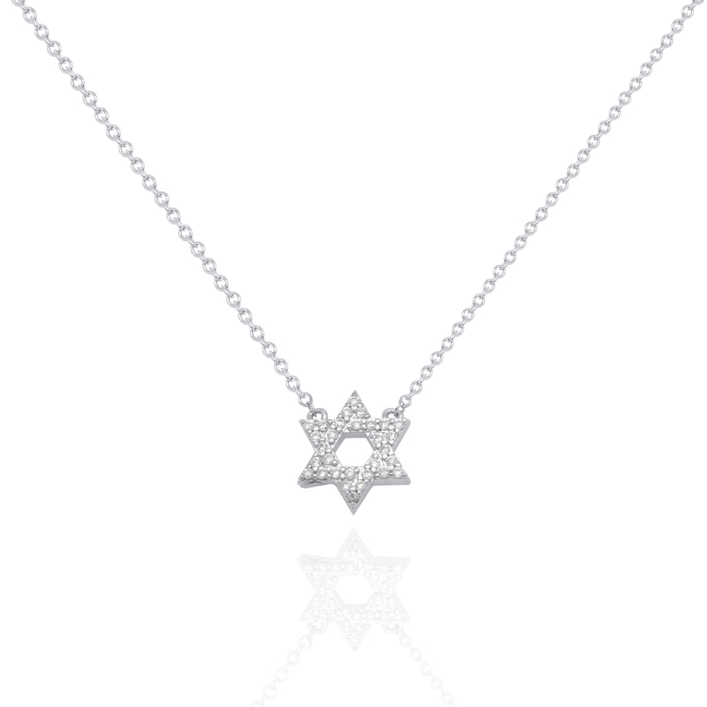 A delicate silver chain necklace featuring a Star of David pendant paved with small clear stones, displayed on a clean white background with a soft reflection below.