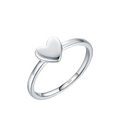 Silver heart-shaped ring on a blue background