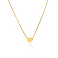 Gold heart-shaped pendant necklace on a white background