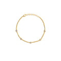 Gold bracelet with small diamonds on a white background
