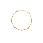 Gold bracelet with small diamonds on a white background