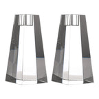 Two geometric glass candle holders on a white background