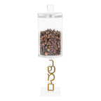 Clear hanging container with cloves and gold hook on a white background