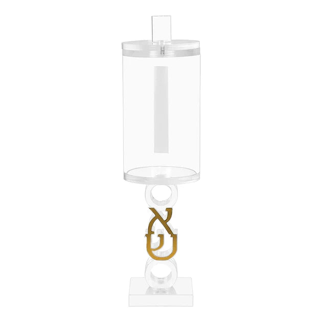 Clear cylindrical box with gold pendant on a white background