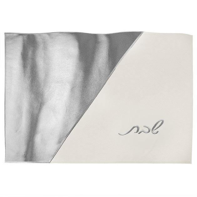 Two-toned fabric with silver and white sections, embroidered with hebrew letters, on a white background