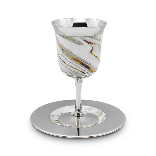 Silver goblet with marble-like pattern on a white background