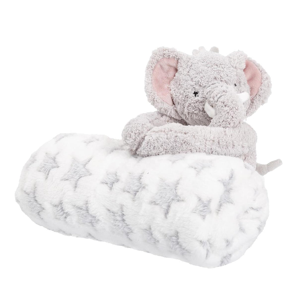 A plush gray elephant toy sitting on a white fluffy pillow with gray star patterns, photographed on a clean white background.