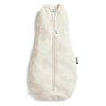 Beige baby sleeping bag with a zipper on a white background
