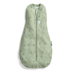 A sage green baby sleep sack with a subtle all-over leaf print, featuring a front zipper closure and a small white brand label on the chest.